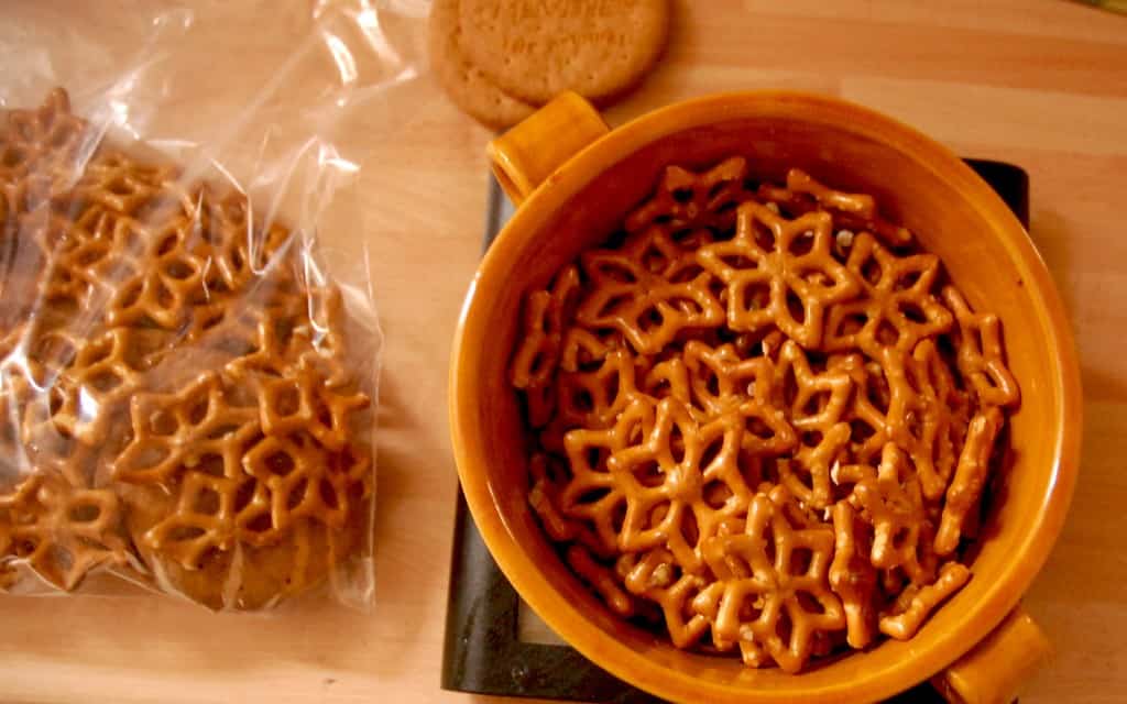 Pretzels in a ziplock bag, pretzels being weighed on scale and digestives