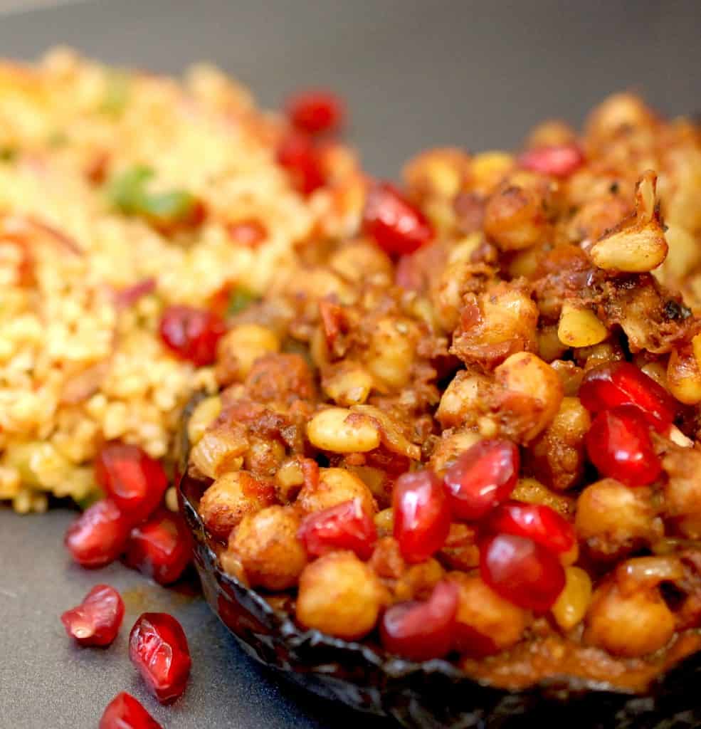 Aubergine stuffed with spicy chickpea with pomegranate on top and kisir to the side