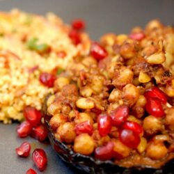 Aubergine with chickpeas and pomegranate and kisir to the side