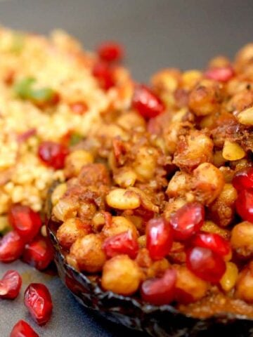 Aubergine with chickpeas and pomegranate and kisir to the side