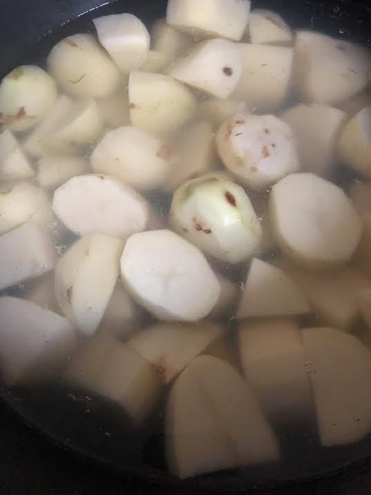 Potatoes in pot ready to be boiled