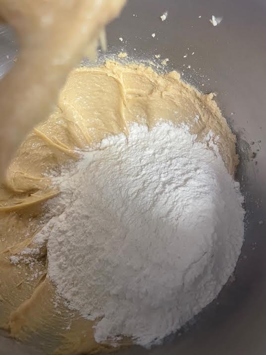 Flour added to batter in bowl