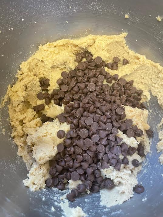 Chocolate chips added to batter in bowl