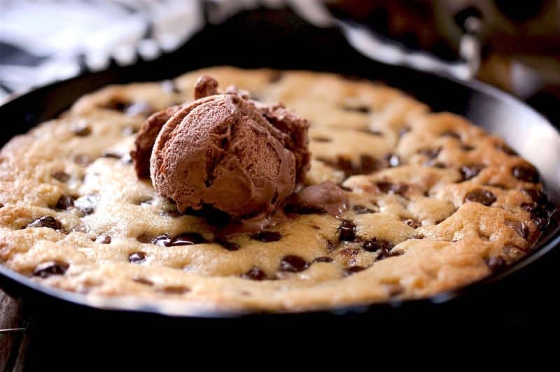 Cookie Dough in black ramekin with chocolate ice cream on top