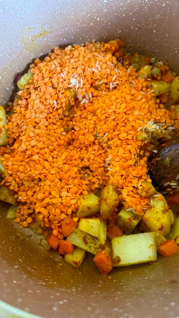 Lentils and rice added to pot