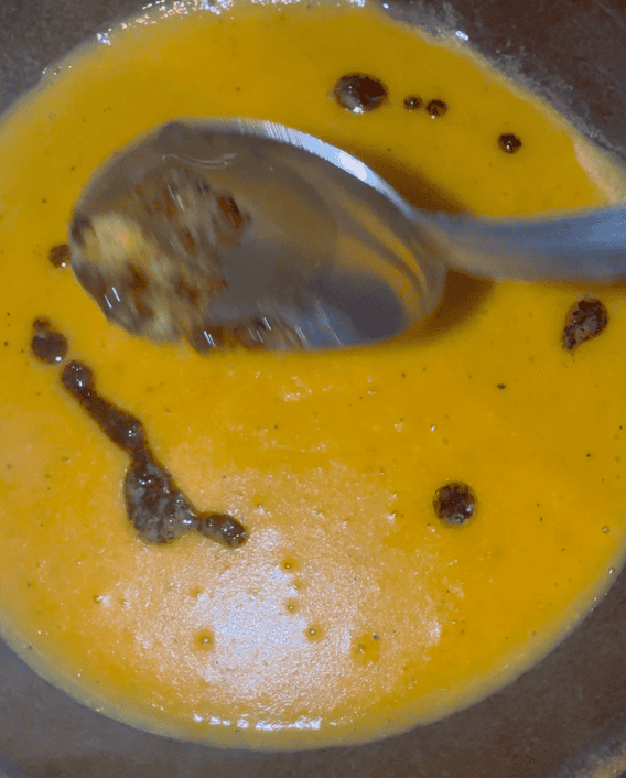 Soup with aleppo butter on top