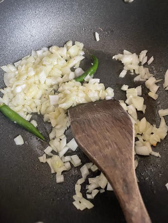 Onions, Oil and Green Chilli in pot