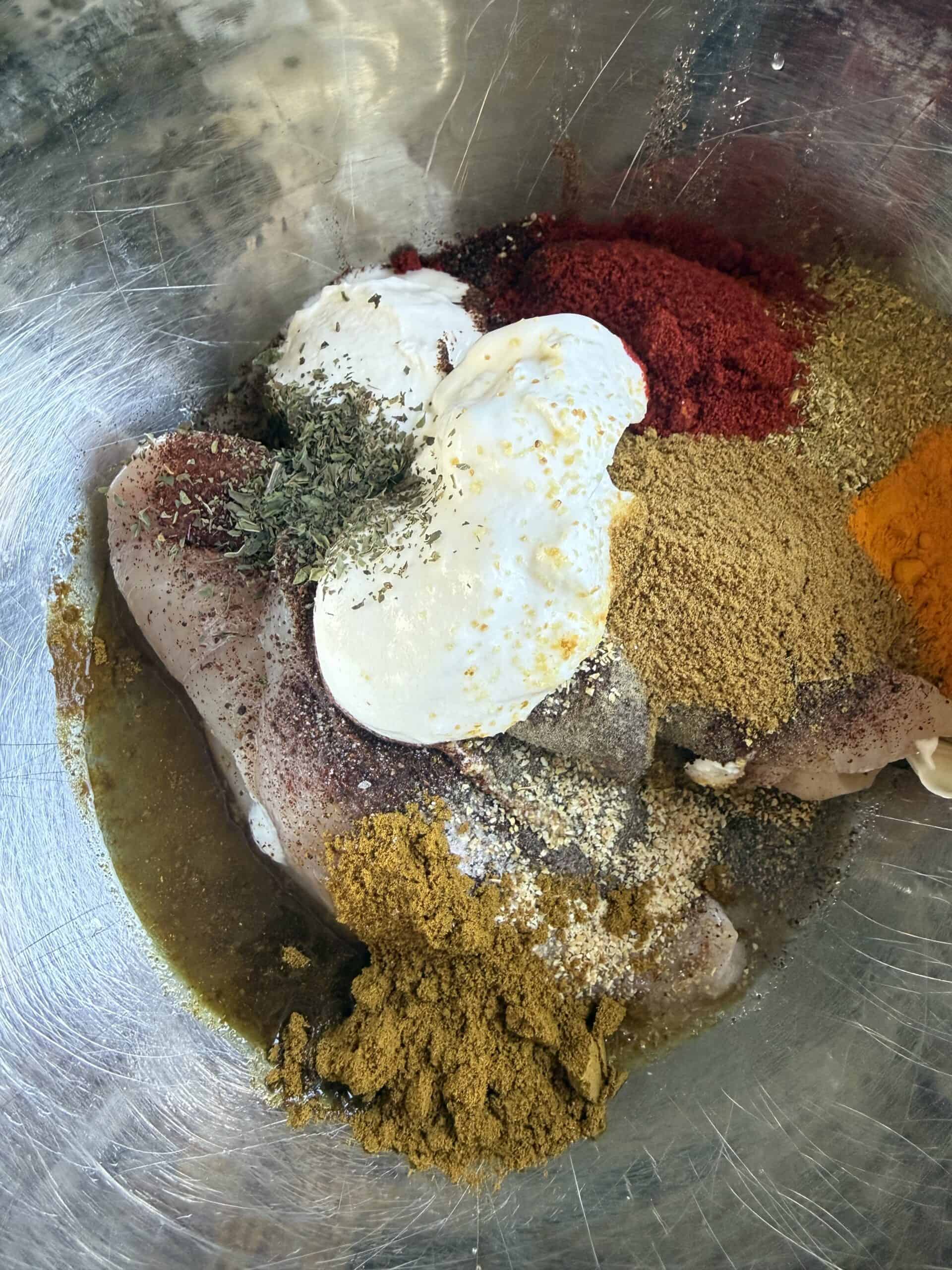 Tandoori Chicken Rice Bowls Chicken breast with marinade ingredients in bowl
