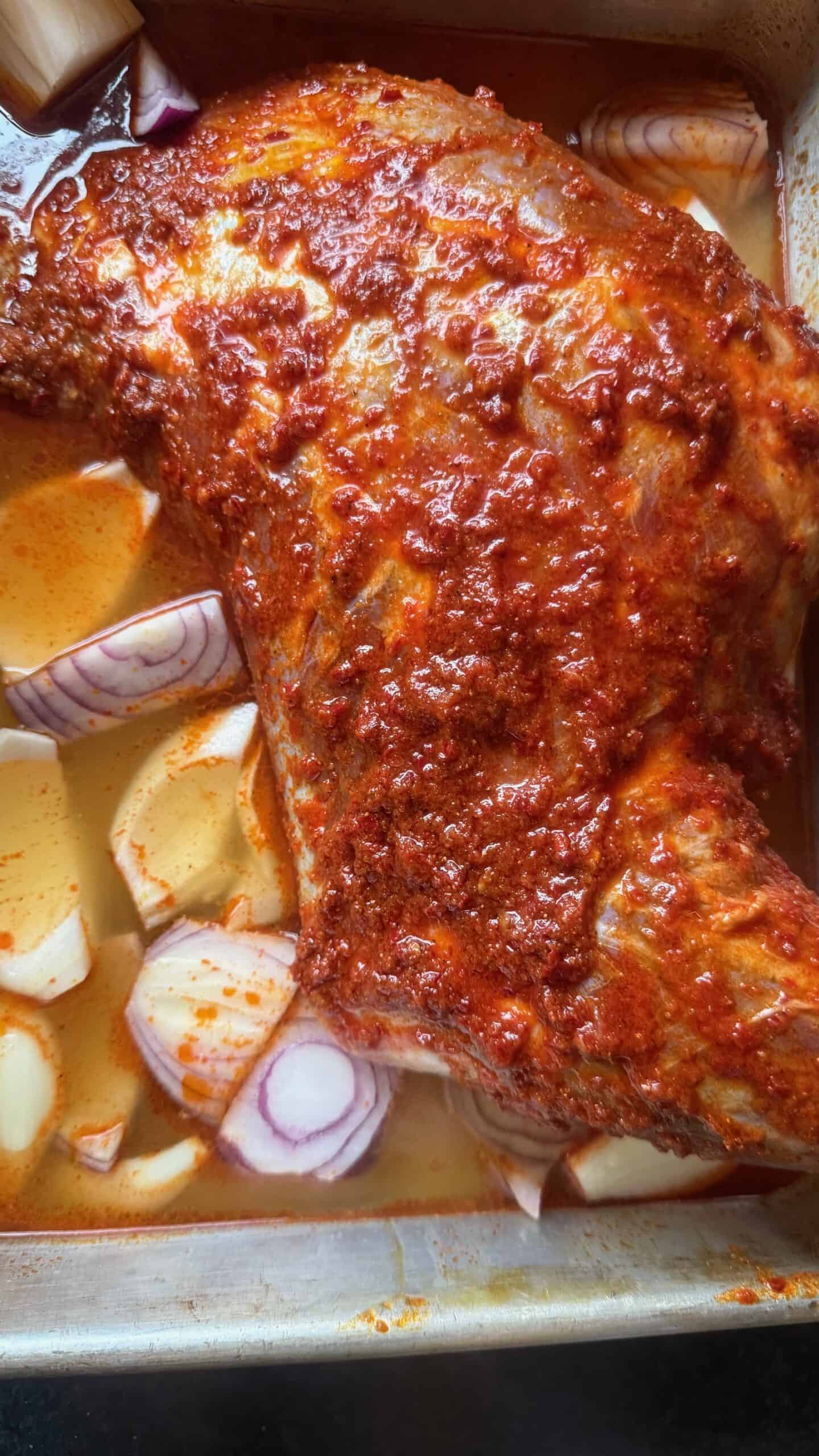 Slow Cooked Middle Eastern Lamb Shoulder with Harissa (Falling Off the Bone) Lamb shoulder in tin with stock and veg