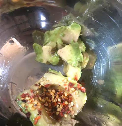 Avocado, Chilli Flakes and Lime Juice in bowl