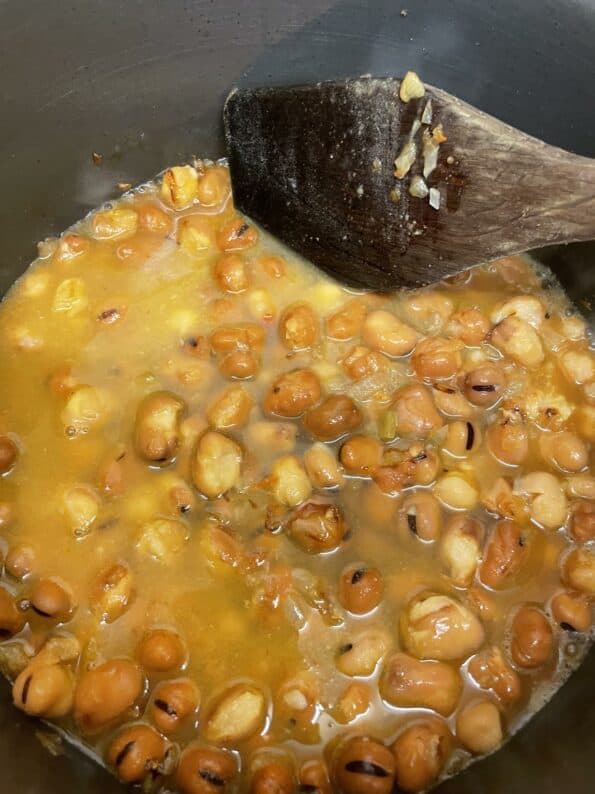 Water added to beans in pot