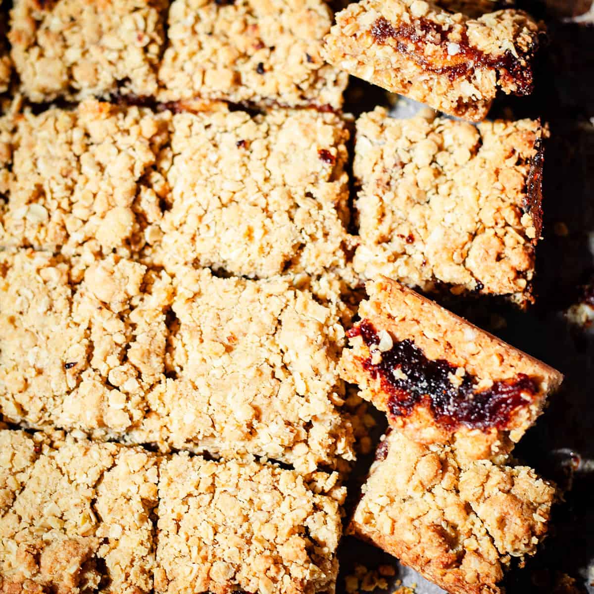 Date Bars cut into squares on baking paper