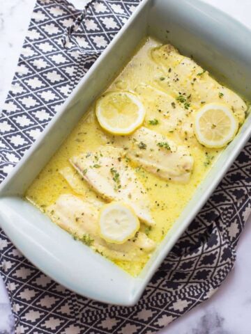 Fish fillets in a lemon and mustard sauce in a casserole dish