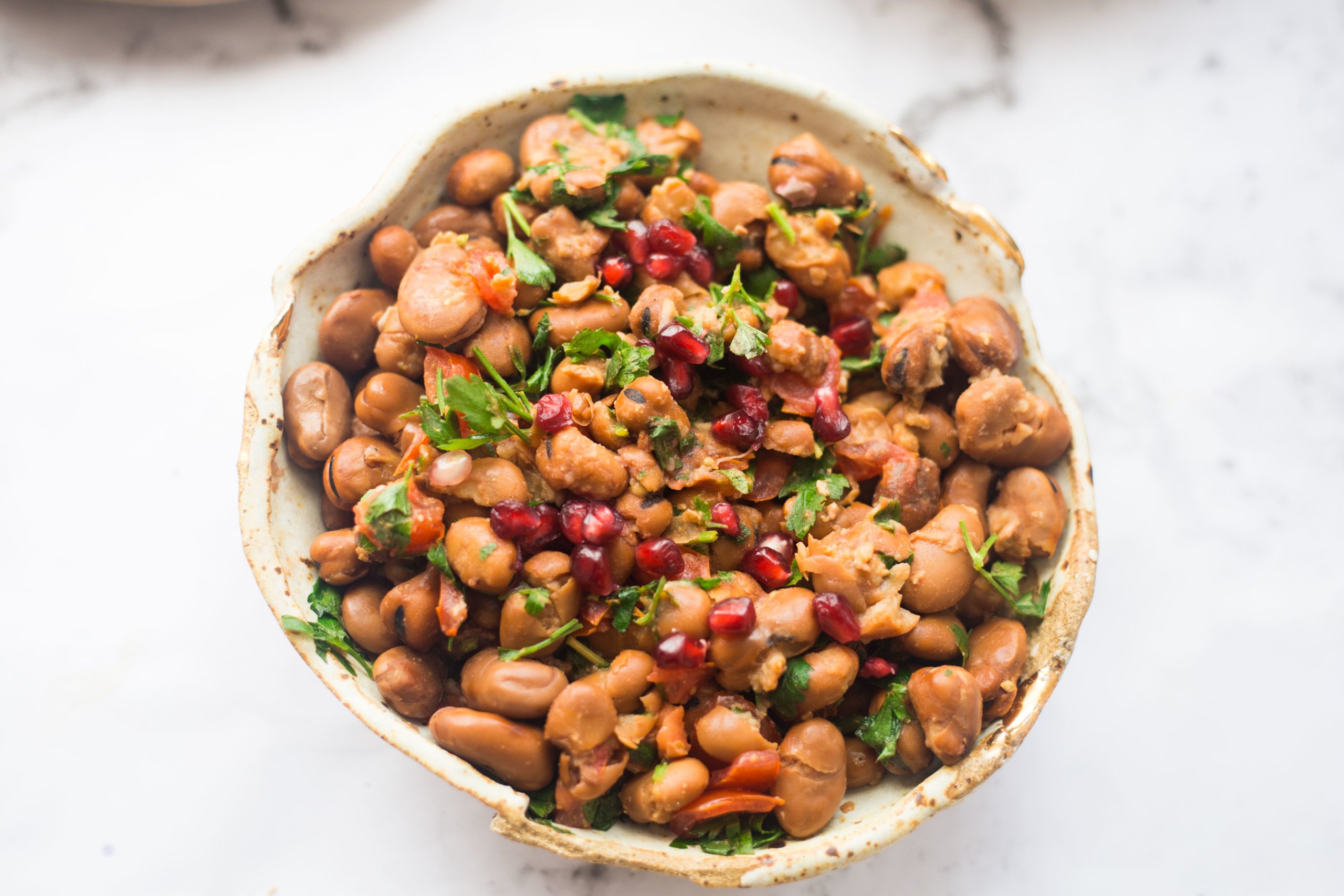 Medames and pomegranate in bowl
