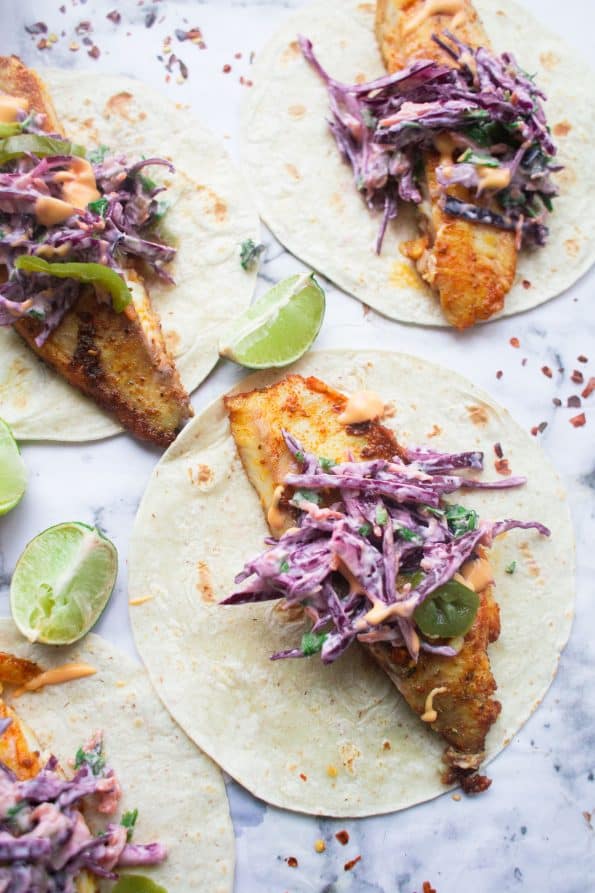 Fish Tacos with Slaw and lime wedges