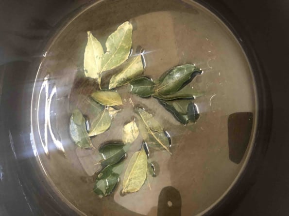 Curry leaves in Oil in pan