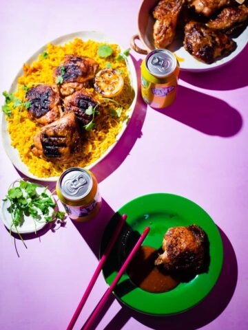 Peri chicken and rice platters on table