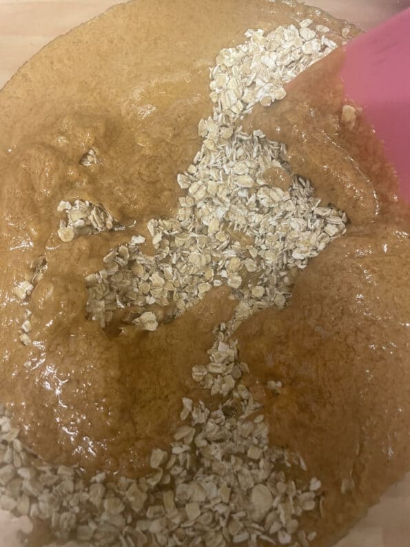 Peanut Butter mixture and Oats in a large bowl