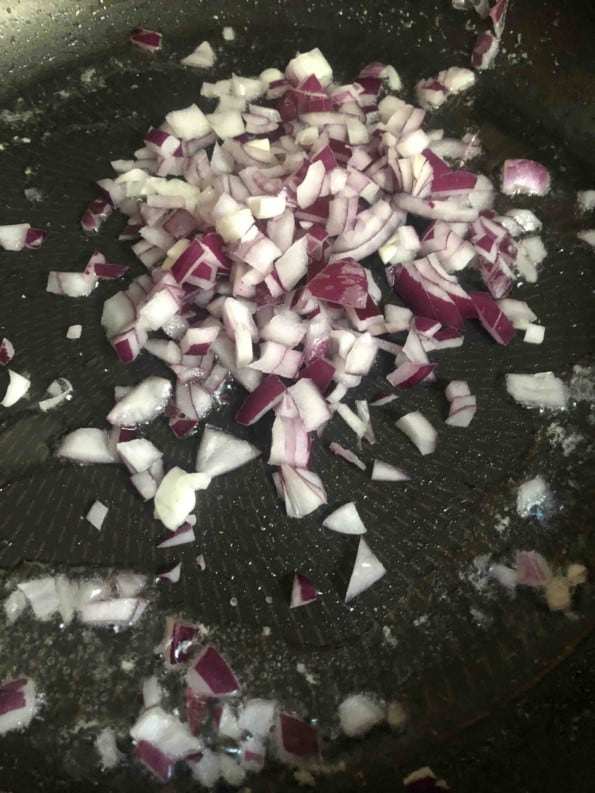 Chopped onions added to pan