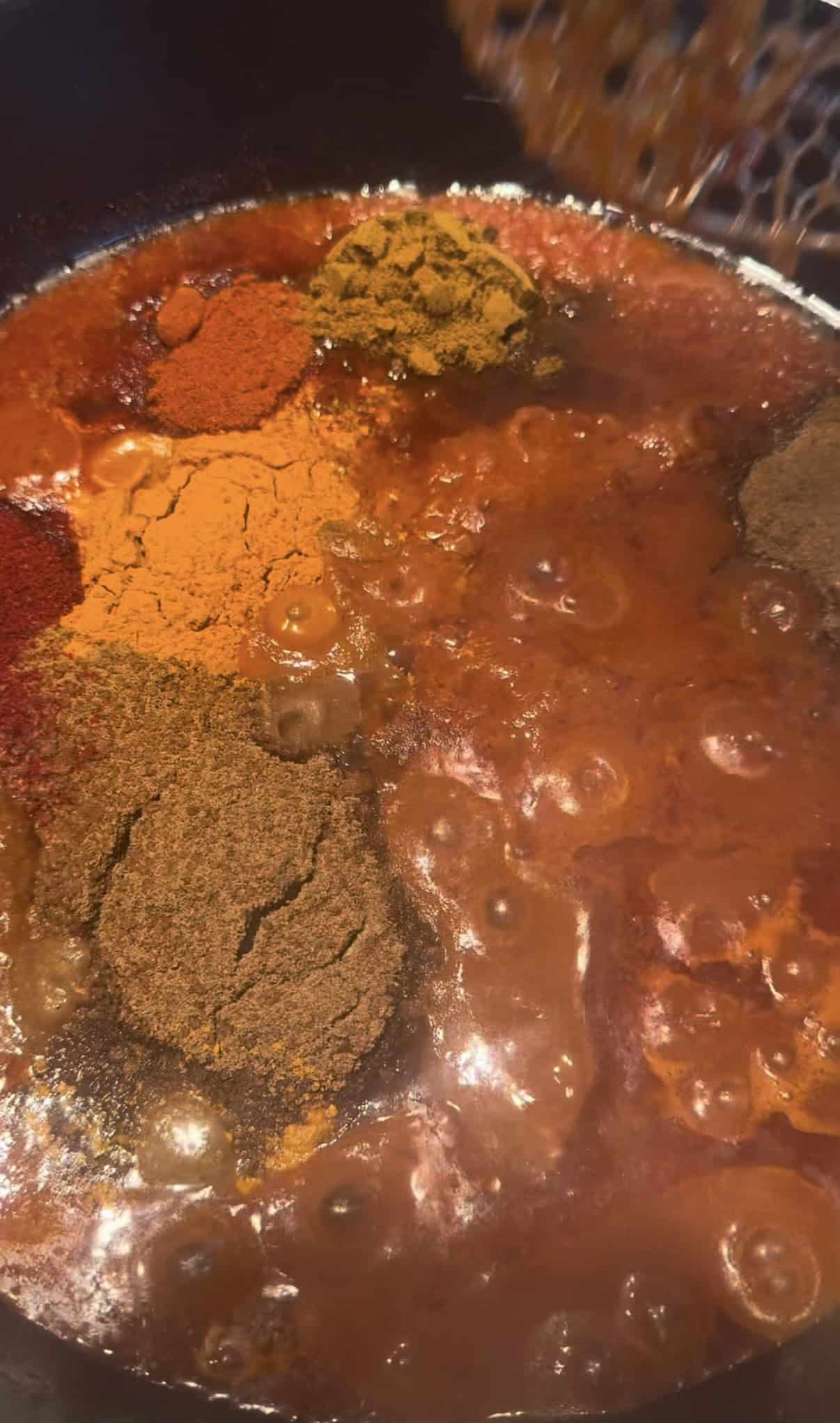 Ground Spices added to pot