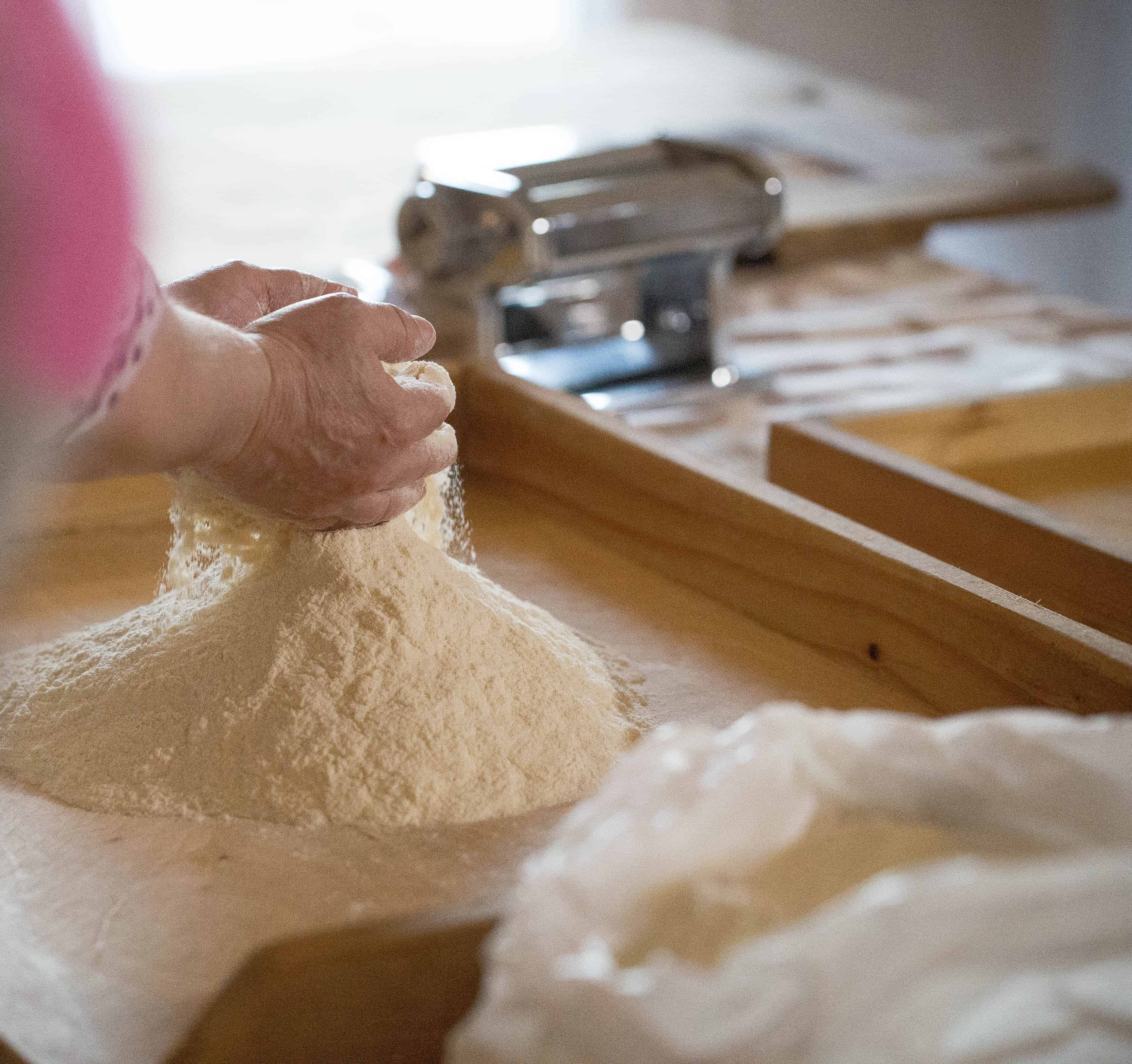 Flour being scooped in hands