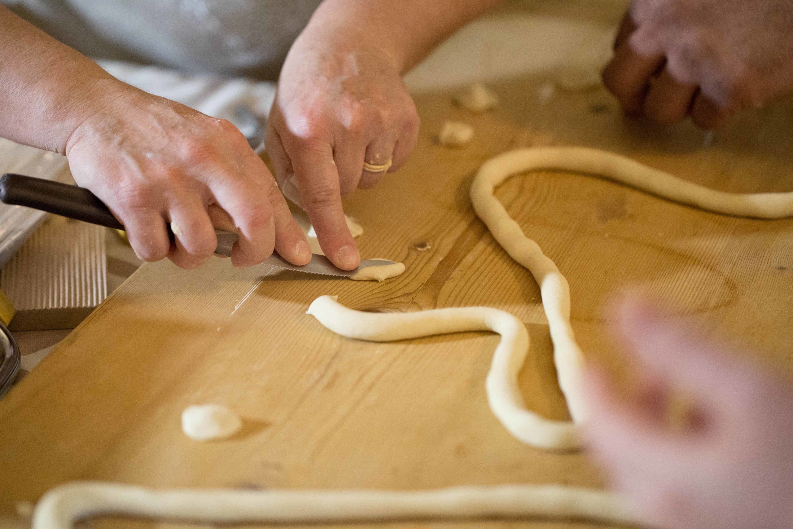 Teacher demonstrating pasta making