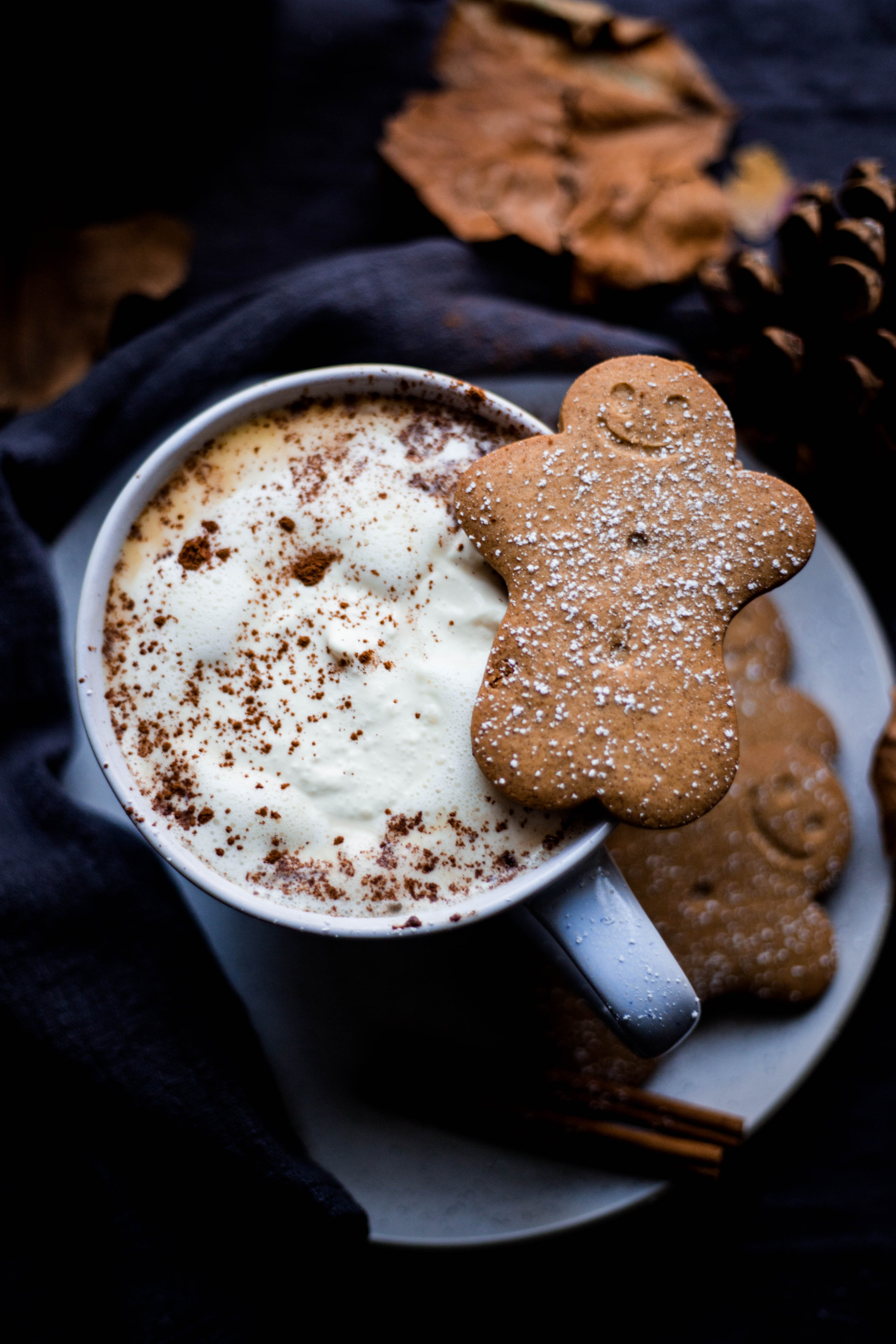 Copycat Gingerbread Latte in a cup with gingerbread on cup