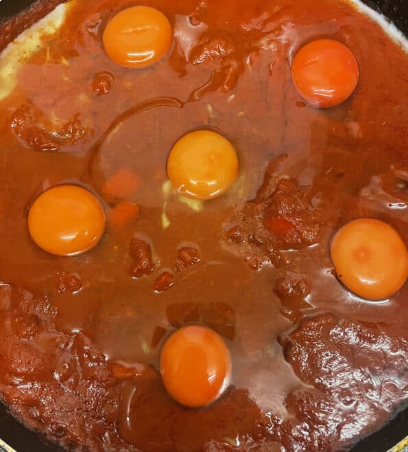 Eggs added to Tomatoes in pan