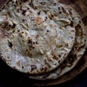 Two Gluten Free Millet Patties on a Wooden Chopping Board