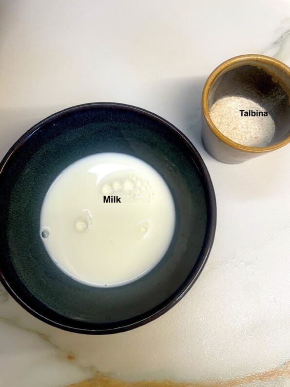 Talbina ingredients - milk and talbina on table