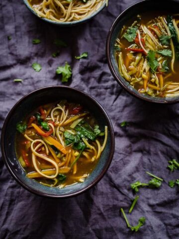 3 bowls of Vegan/Vegetarian Healthy Manchow Soup on grey towel