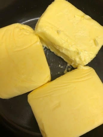 3 Blocks of Butter in a black pot