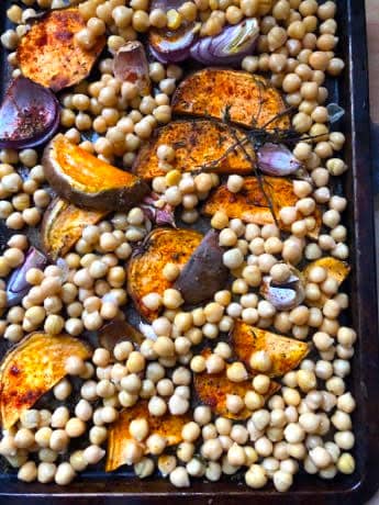 Roast sweet potatoes, red onion and chickpeas in oven tray