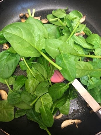 Spinach added to pan