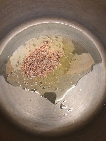 Mustard Seeds in Oil in pan
