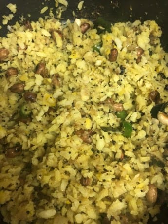 Poha, nuts, curry leaves in pot