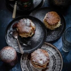 Scones in 3 plates with jam and cream