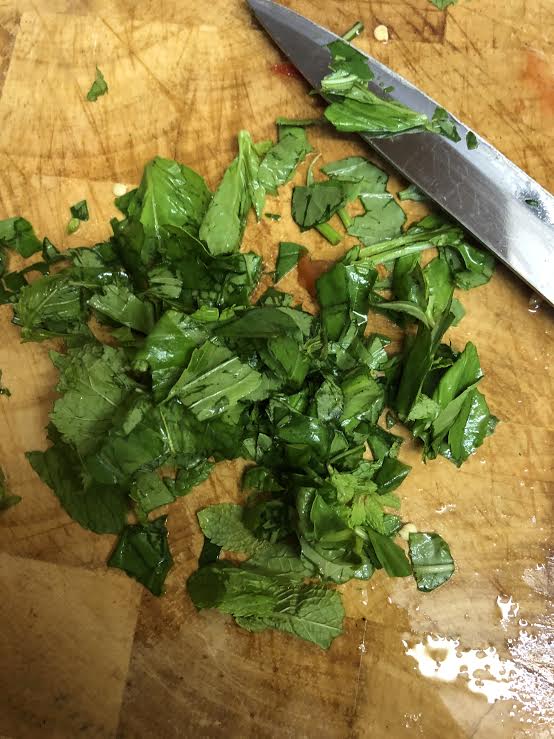 Spinach and mint on a chopping board