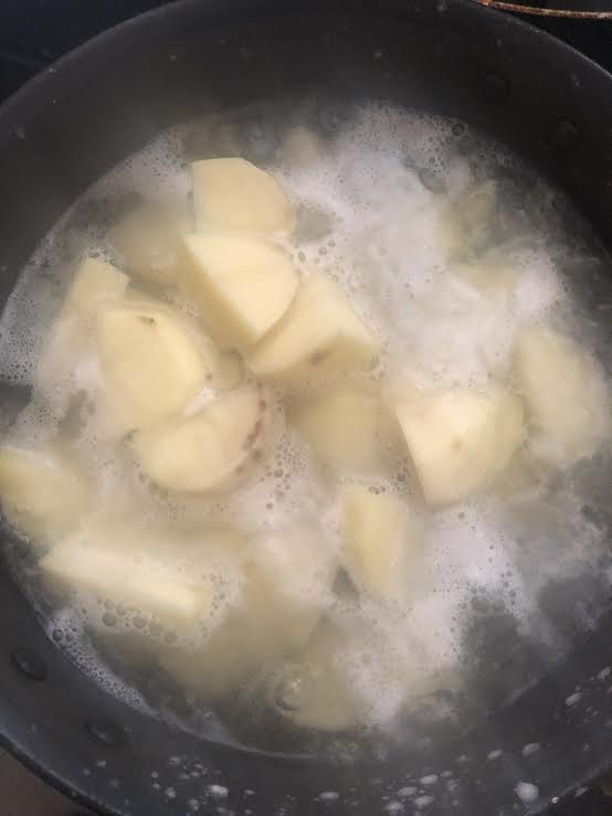 Potatoes boiling in water