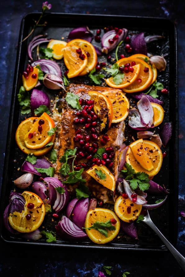 Pomegranate and Orange salmon with red onions in tray