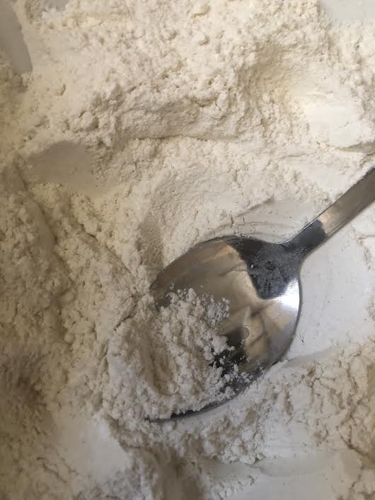 Dry ingredients in bowl with spoon