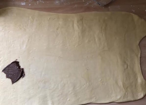 Dough rolled out with 1 patch of Nutella on it