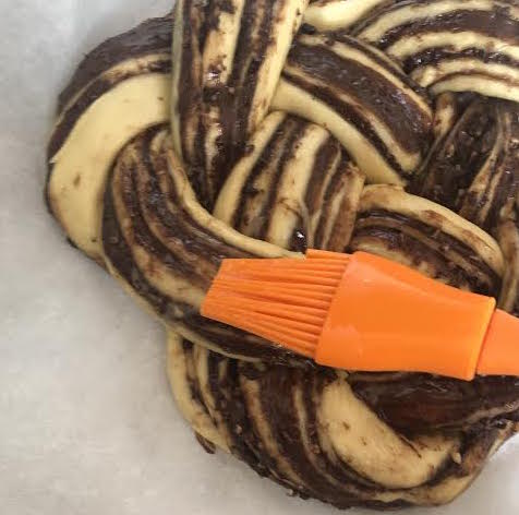 Egg wash being added to Nutella Bread