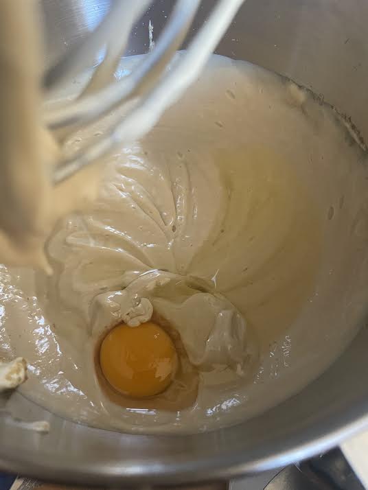Egg in cheesecake batter mixture