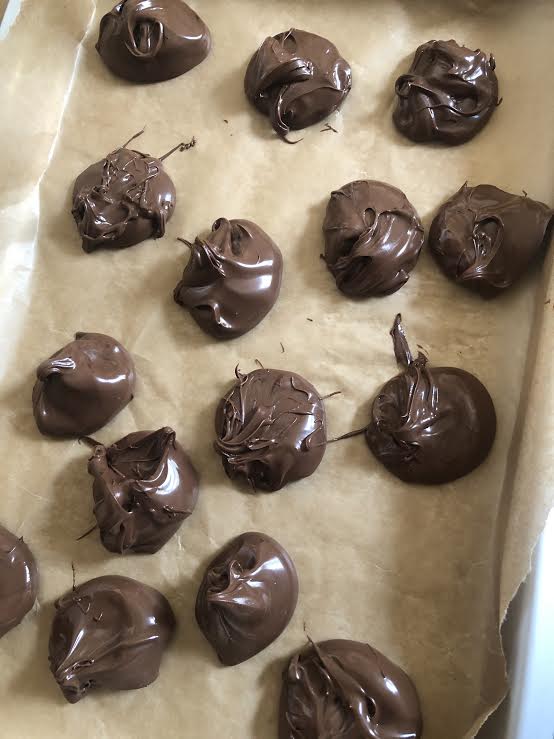 Nutella blobs on lined baking tray 