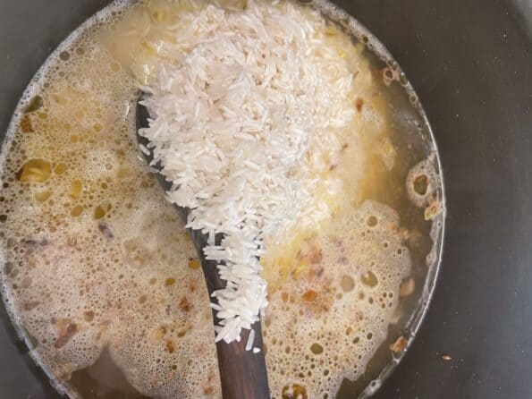 Rice being stirred in pot