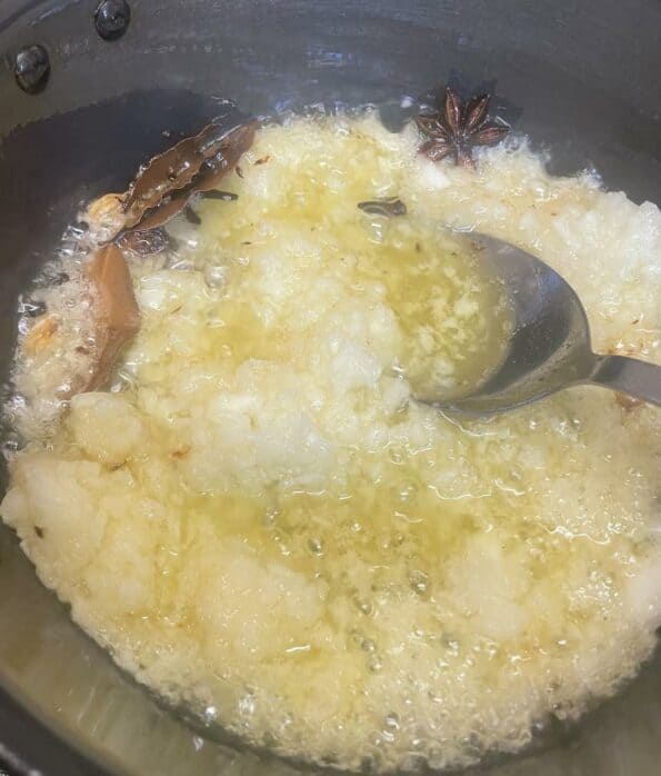 Onions cooking in oil and ghee