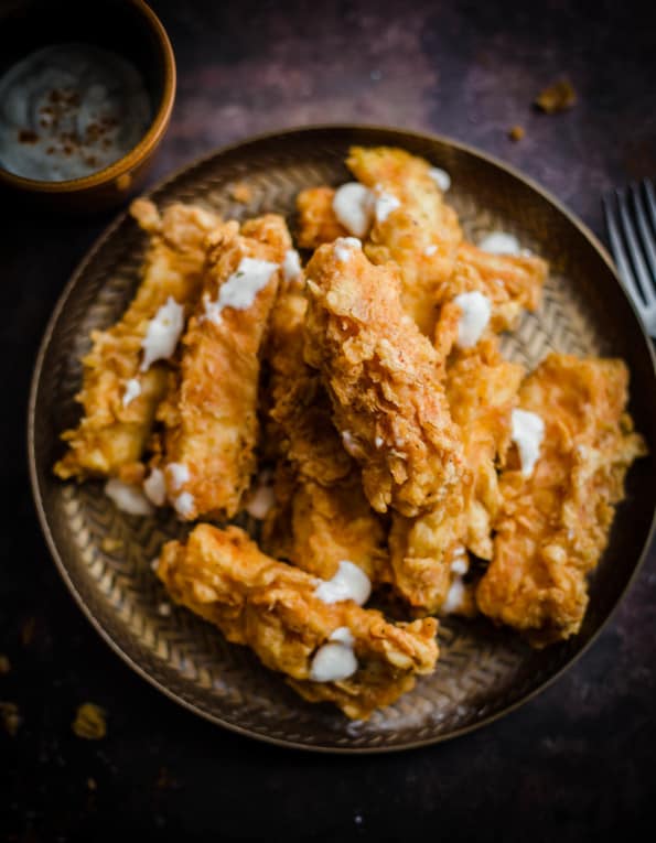 Halloumi Fries in plate with sour cream topping