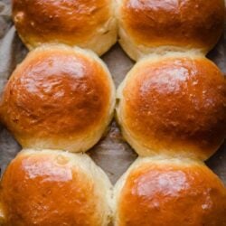 Baked buns on lined tray