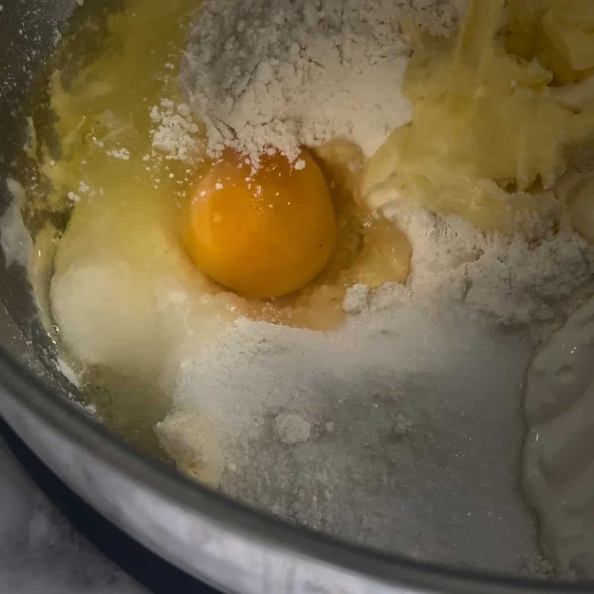 Egg, flour, sugar in bowl